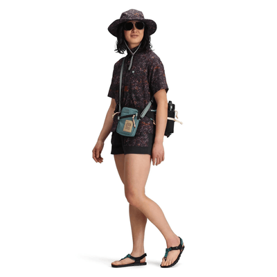 woman wearing topo designs mini shoulder bag 1L as sling bag