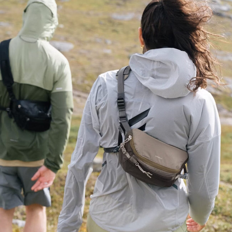 women hiking wearing sandqvist lo all black and army outdoor lifestyle