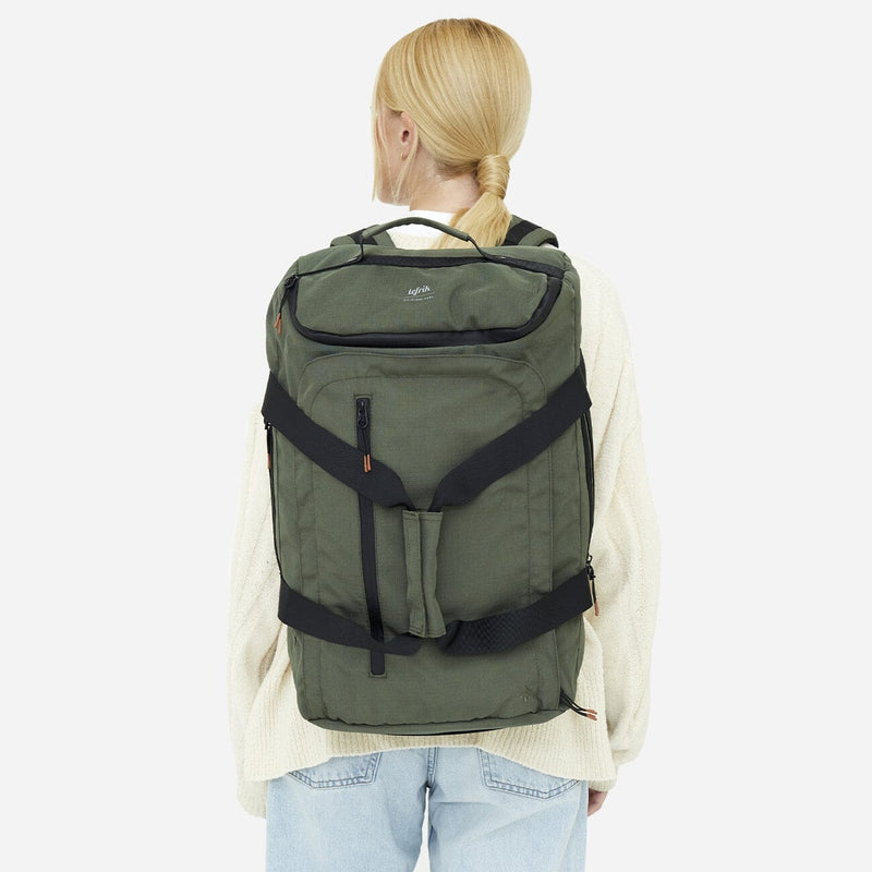 women wearing green eco friendly convertible backpack back view