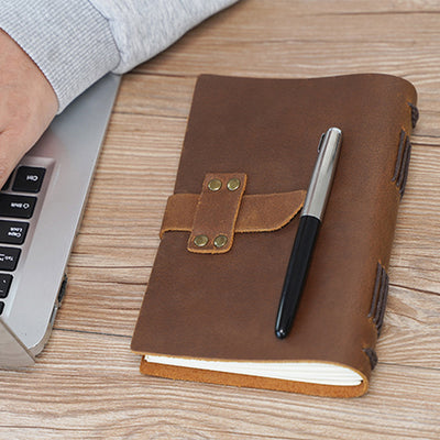 brown leather notebook