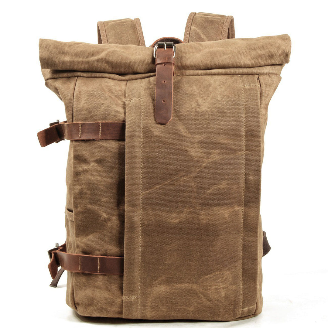 Canvas motorcycle backpack in khaki with crazy horse leather flap, twin leather strap closures and antiqued brass hardware, Eiken Gstaad model