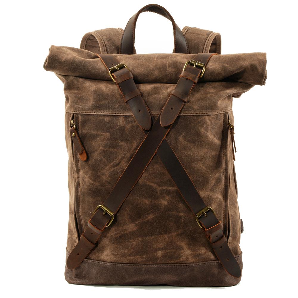 Canvas rucksack backpack in coffee brown with full-grain leather strap closures, brass buckles and adjustable shoulder straps — Oslo