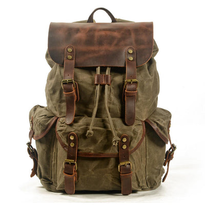 green army canvas and leather backpack