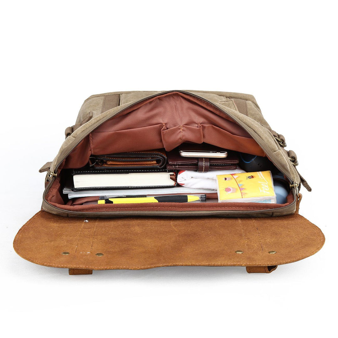 Khaki Haliburton interior packed for everyday carry with notebooks, phone, wallet, snacks and camera dividers