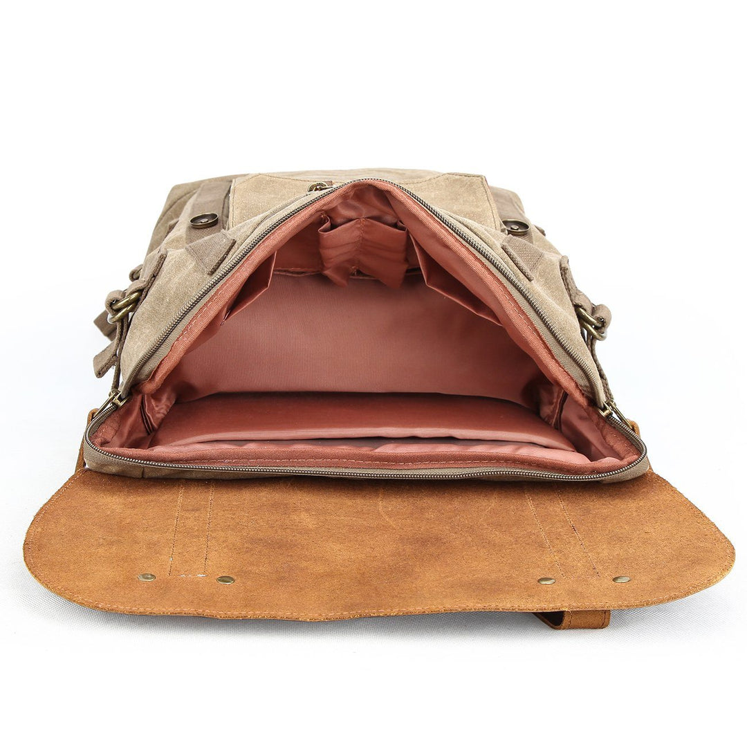 Open interior of the Haliburton khaki camera backpack with foam-padded modular camera dividers for DSLR and lenses