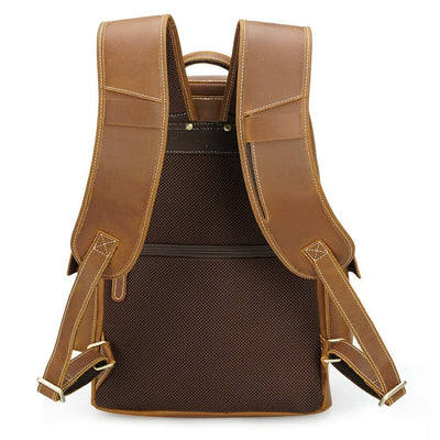 padded back panel of a coffee leather brown backpack