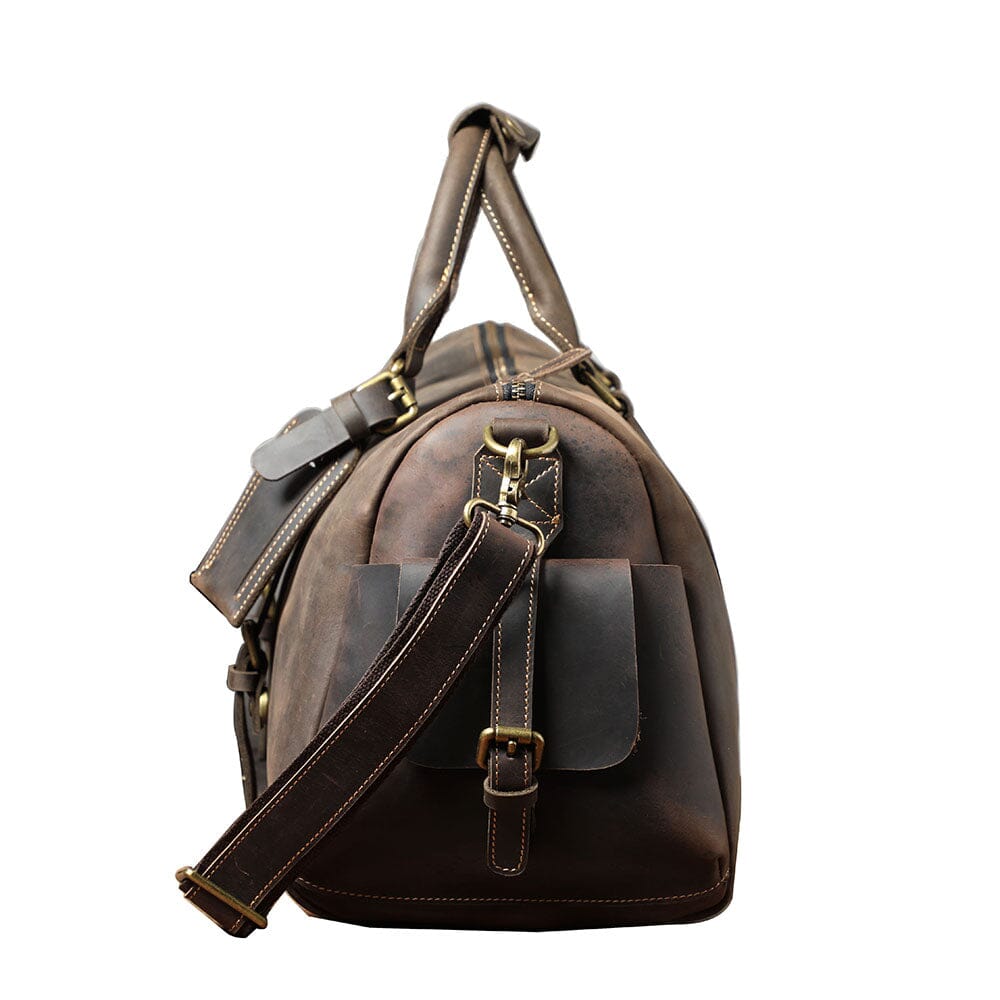 side view of a leather travel duffle bag, brown color