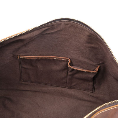 roomy and handy interior slot pockets of a leather duffel bag