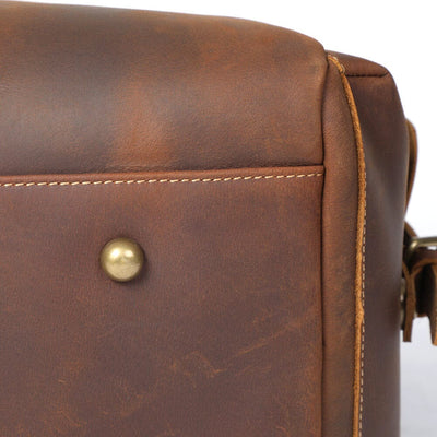 Close-up of protective bottom rivet detail on Leather Duffle Bag