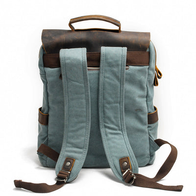 vintage rucksack for men in light blue, back view, padded straps and secret anti-theft pocket