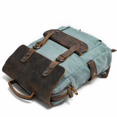 men and women vintage canvas bookbag in light blue, leather cap and straps