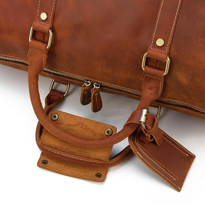 light brown leather duffle bag