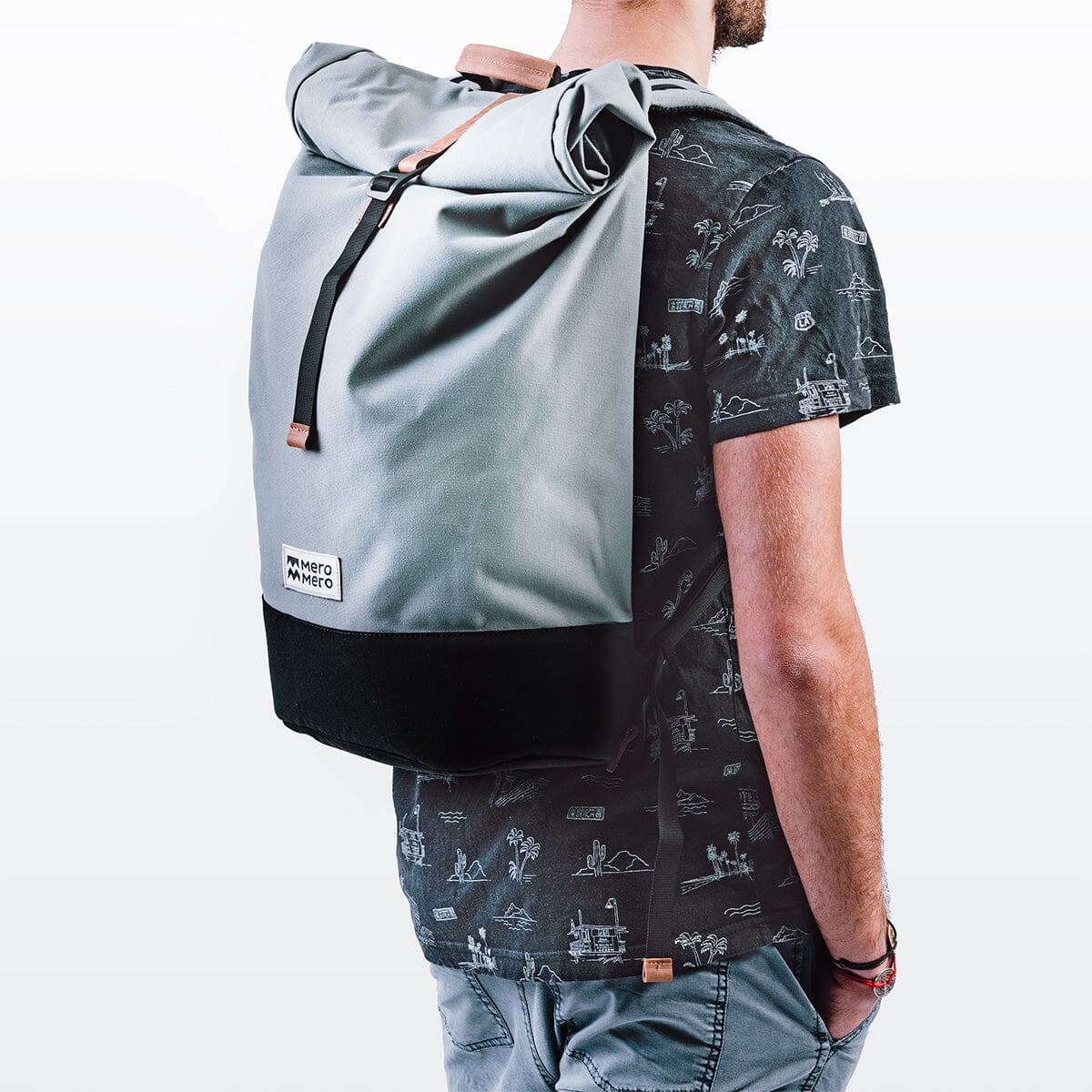 men model wearing a grey recycled nylon backpack named squamish from mero mero