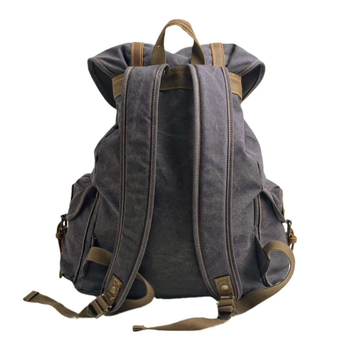 Back panel of the dark grey Montreal canvas rucksack with padded cotton canvas shoulder straps, top grab handle and reinforced anchor stitching
