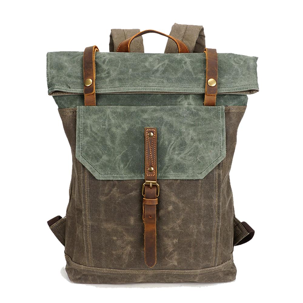 Vintage backpack in army green waxed canvas with full-grain leather flap and antiqued brass buckles — Yukon