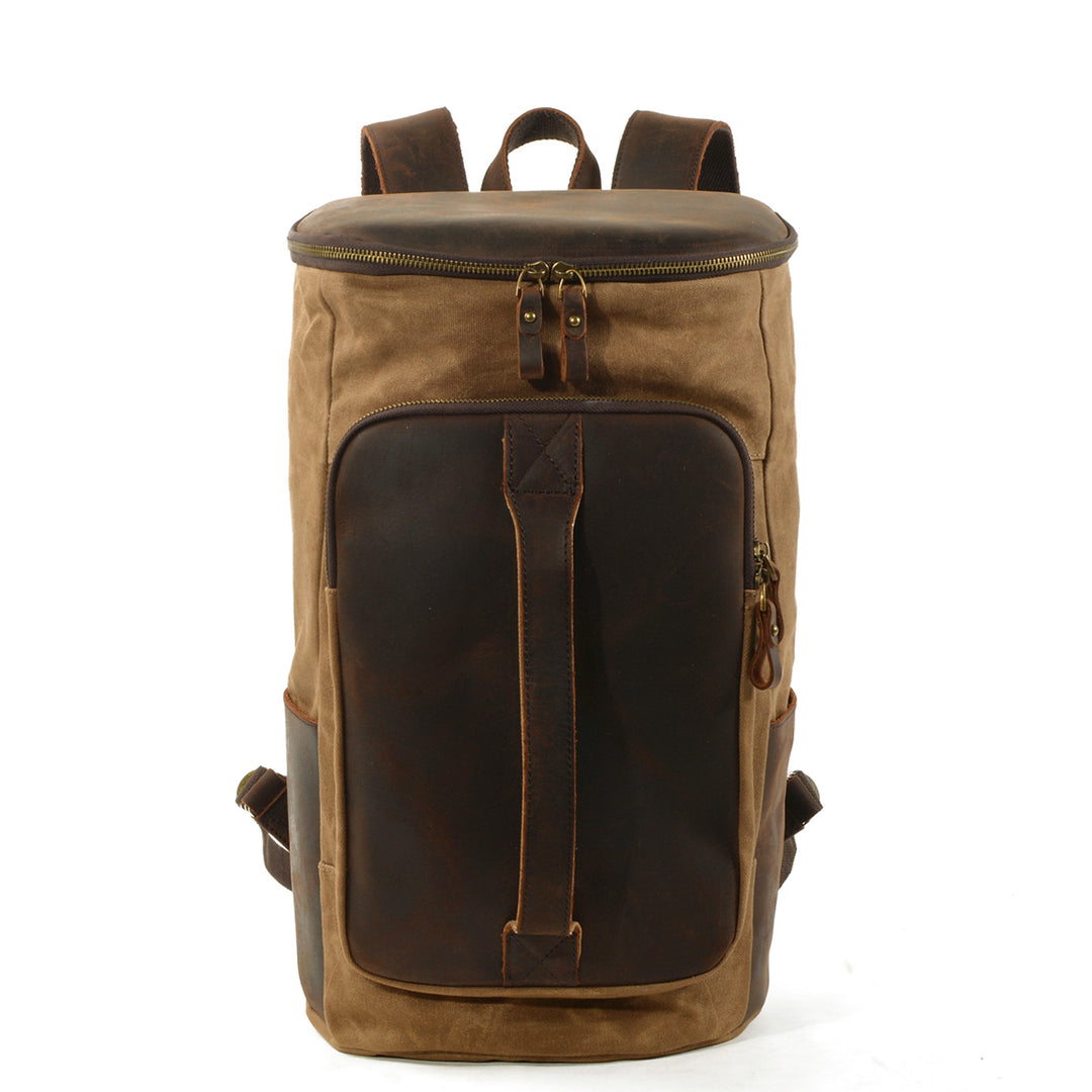 Vintage canvas rucksack in khaki tan with full-grain leather face panel, top zip closure and antiqued brass YKK hardware, Eiken Amsterdam model