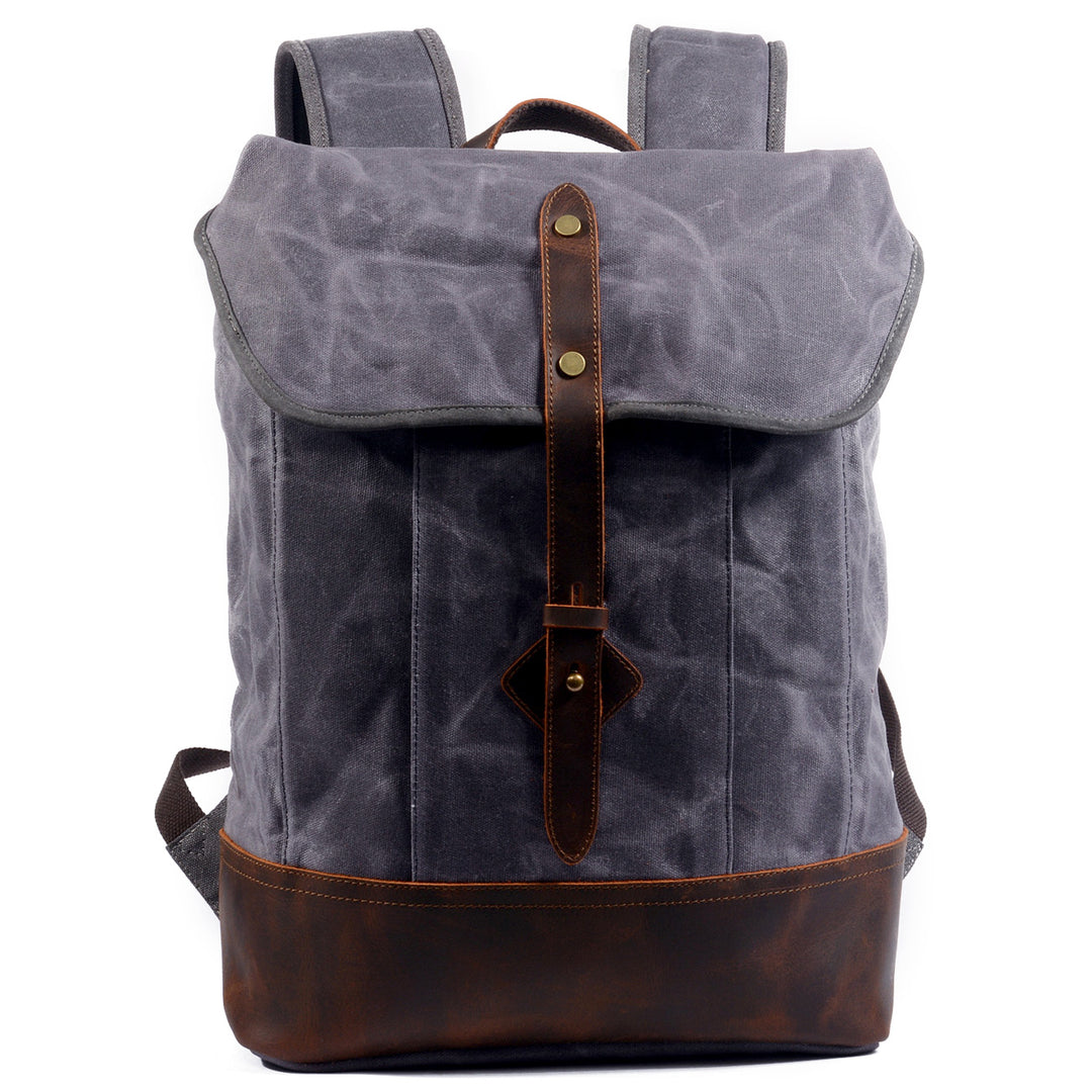 Wax canvas backpack in grey with full-grain leather flap, twin leather strap closures and antiqued brass hardware, Eiken Vancouver model