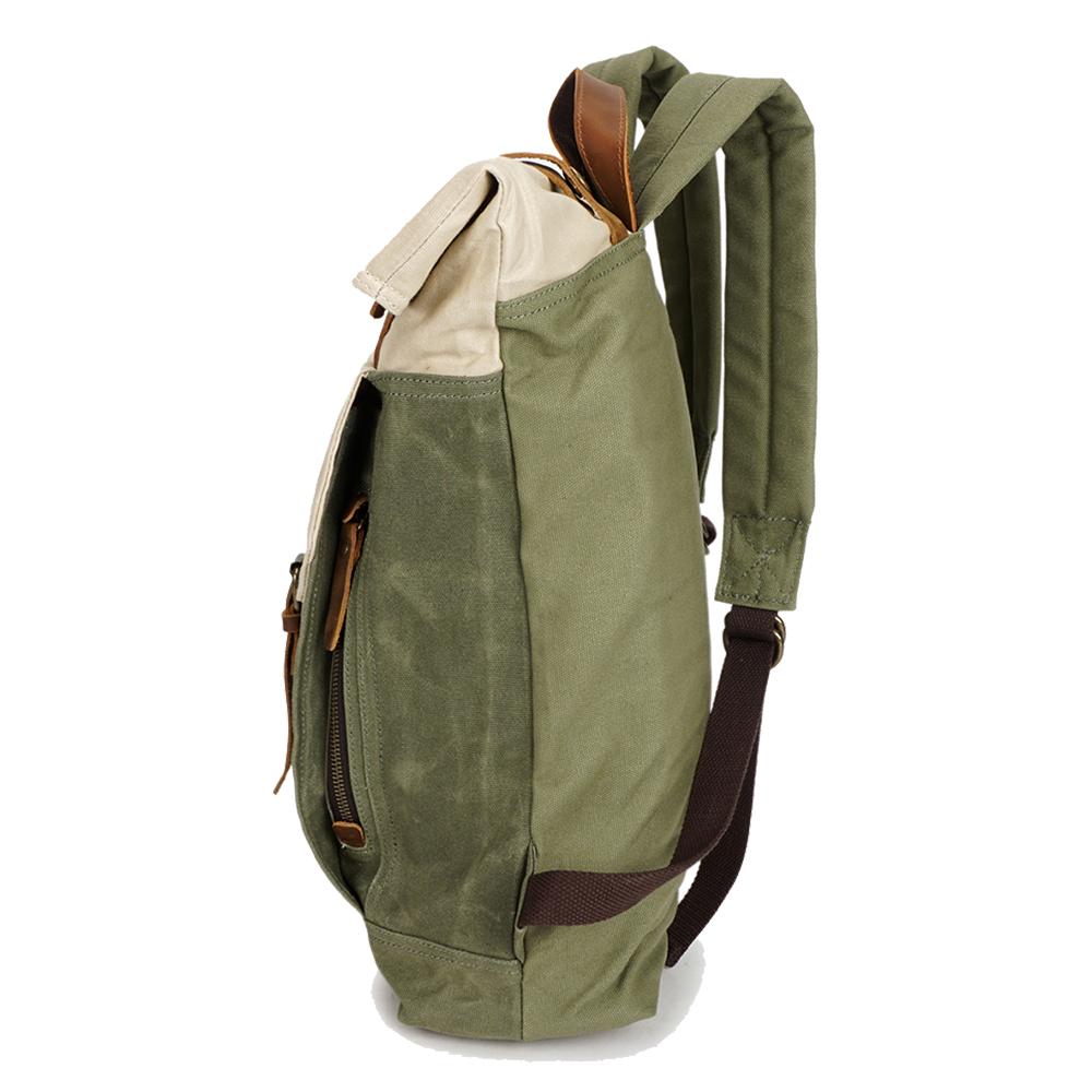 Three-quarter view of the Yukon vintage canvas backpack revealing depth, side cargo pocket and leather flap closures